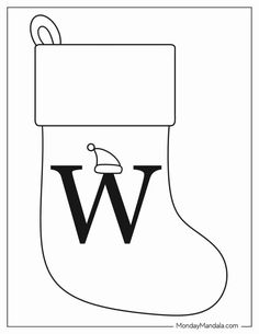 a black and white christmas stocking with the letter w on it's side