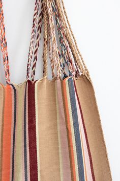 These versatile totes are handwoven by artisans in Chiapas, Mexico on a backstrap loom. Perfect for a beach day, the farmer's market, or as an everyday purse! Designed by and created exclusively for The Global Trunk. This bag is approx. 16" wide x 26" tall with the strap. Due to the handmade nature, height and width of bag can vary up to 10% and product and color may vary from product photo. Summer Beach Bag With Weaving For Everyday Use, Eco-friendly Woven Beach Bag For Market, Beach Tote Shoulder Bag With Weaving Work, Hammock Bag, Backstrap Loom, Everyday Purse, Farmer's Market, Beach Day, Hammock