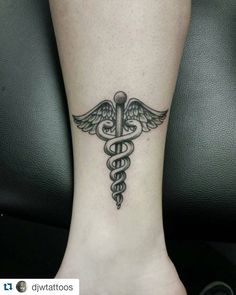 a medical symbol tattoo on the ankle