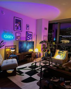 a living room filled with furniture and purple lighting