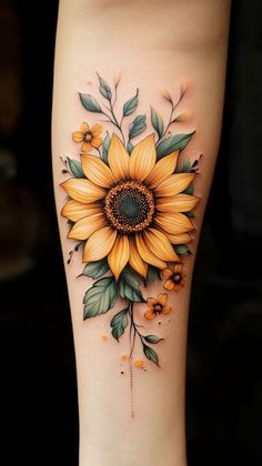 a sunflower with green leaves and yellow berries on the side of a woman's leg