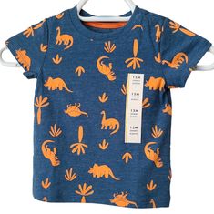 Short Sleeve Tee, Nwt, Blue With Orange Dinosaur Print. Summer Dinosaur Print Short Sleeve Tops, Orange Cotton Tops With Cartoon Print, Orange Cotton Top With Cartoon Print, Blue Dinosaur Print Short Sleeve T-shirt, Cotton Tops With Dinosaur Print For Summer, Blue Dinosaur Print Top For Playtime, Playful Orange Tops For Playtime, Crew Neck Top With Dinosaur Print For Playtime, Casual Blue Top With Dinosaur Print