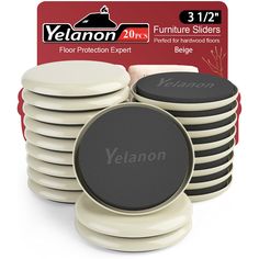 yellowon furniture sliders are stacked on top of each other in front of a card