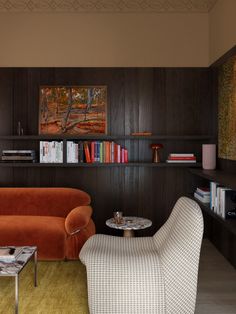 a living room filled with furniture and bookshelves