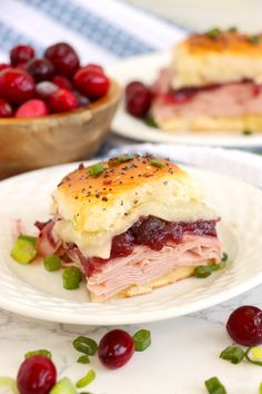 a ham and cranberry sandwich on a plate