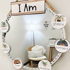 a mirror that has some words on it and a chair in front of the mirror