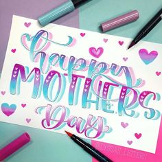 a mother's day card surrounded by markers and crayons on a table