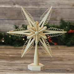 Hand-carved curly wood chip star tree topper with traditional German design elements Shelf Measurements, Tree Carving, Star Tree Topper, Wood Chips, German Christmas, Tree Tops, Wooden Buttons, Tree Topper, Hand Carved Wood