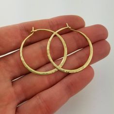 "Gorgeous Hammered Solid 18k Hoops made from 16 gauge (1.3mm) wire. 1.25\" Size photographed; 2\" size in 14k yellow gold shown in video METAL: Solid 18k Yellow Gold WIRE GAUGE/DIAMETER: 16 gauge (1.3mm) wire - Currently the thickest wire I offer EAR WIRE THICKNESS: Due to the thickness of the wire, the ear wire portion of the hoops will be tapered to approximately 18g, which is slightly thicker than standard ear wire thickness HAMMERED EFFECT: Each earring is made as a mirrored pair and the tex Saint Helens, Christmas Gifts For Wife, Earrings Christmas, Gold Wire, Gift For Wife, Metal Earrings, Ear Wire, Gifts For Wife, Heart Ring