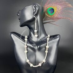 This single strand Seed Pearl and pewter Set is designed with the highest standards of craftsmanship. Expertly crafted from the finest materials, the set is composed of a blend of seed pearls and pewter, creating a timeless and elegant piece. Each set is unique and sure to elevate any outfit.* Earrings - 0.5" width, 2" drop & Weighs 0.21 oz approx.* Pendant - 0.5" width, 2" length & Weighs 0.19 oz approx.* Chain - 18" length. * Materials: Seed Pearls, Pewter* Technique: Weaving Stitches* Style: Formal Pearl Necklace With Silver Beads, Elegant Pearl Necklace With Silver Beads, Elegant Pearl White Necklace With Silver Beads, Silver Beaded Pearl Necklace, Elegant Pearl White Necklaces With Silver Beads, Elegant Silver Pearl Necklace With Silver Beads, Elegant Pearl Necklace With Silver Round Beads, Formal Pearl Jewelry With Silver Beads, Pearl Jewelry With Silver Beads