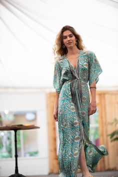 Turquoise V-neck Maxi Dress For Vacation, Turquoise Maxi Dress For Beach Season, Flowy Boho Print Dress With Kimono Sleeves, Flowy Dresses With Boho Print And Kimono Sleeves, Turquoise Sundress Maxi For Beach, Green Bohemian Holiday Dress, Printed Beachwear Maxi Dress For Festivals, Beach Season Printed Maxi Dress With Kimono Sleeves, Turquoise Beachwear Maxi Dress For Beach