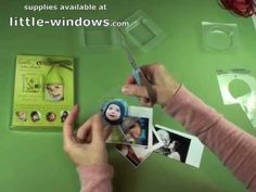 a person holding a pair of scissors near pictures and other items on a green surface