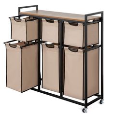 PRICES MAY VARY. ✅A VERSATILE HELPER - Suntage laundry hamper organizer is a flat-top laundry organizer that uses 6 laundry bags to pre-sort laundry and laundry room storage. This dirty clothes hamper has a top laminate panel with a rustic brown finish. It provides a smooth top storage shelf, perfect for folding laundry, holding large laundry baskets, or storing bathroom toiletries. ✅STURDY CONSTRUCTION - The hamper baskets are made of particle board and metal frame. Which is not easily deformed Hamper Organizer, Laundry Sorter Hamper, Over Toilet Storage Cabinet, Laundry Basket Organizer, Laundry Organizer, Over Toilet Storage, Bathroom Toiletries, Large Laundry Basket, Laundry Cart