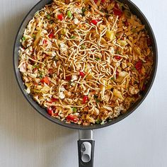 a pan filled with food sitting on top of a stove