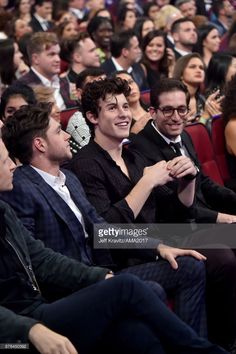 people are sitting in the audience at an event