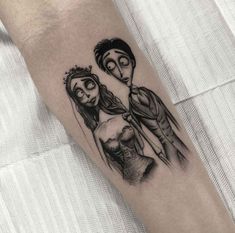 a couple with tattoos on their arm