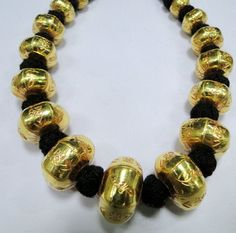 22 K gold Large beads Necklace. Handmade beautiful hollow Gold beads filled with wax inside to give more striength and durablity. Good for wear as is or for your own creation. Length-27 cm ( free size easy to adjust length by pulling the toggle), size of center bead-15/20 MM, Weight-77 grams. Material-22 K gold. Traditional Antique Gold Temple Necklace As Gift, Antique Yellow Gold Jewelry For Puja, Antique Gold Necklace For Diwali, Traditional Heavy Gold Necklaces, Heavy Traditional Gold Necklace, Traditional Heavy Gold Necklace, Traditional Bronze Necklace For Gift, Gold Engraved Necklaces For Festivals, Gold Necklace With Round Beads For Diwali