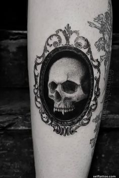 a black and white photo of a skull with a frame on it's leg