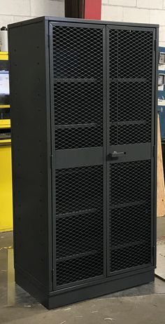 a large metal storage cabinet sitting inside of a building