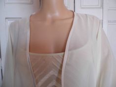 This is a beautiful hand made chiffon kimono ideal as a cover-up for weddings or special occasions. It has a satin edging It can be made in any size from 8 to 24 (UK sizes). It is made in the UK. It is normally sent out to you within 5 days, but I am very happy to make your order a priority if you need it urgently. Just let me know the date needed by. Postage is free in the UK! International postage is £9. I am happy to exchange items or refund your payment if you are less than happy with the pr Chiffon Kimono Jacket, Chiffon Kimono, Kimono Jacket, Beautiful Hand, Bridal Gowns, Camisole Top, Special Occasion, Hand Made, Cover Up