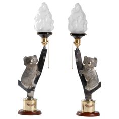 two lamps with koalas on them sitting on top of each other in front of a white background