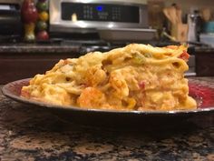 a plate filled with pasta on top of a kitchen counter