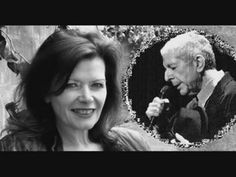 an older man and woman are smiling for the camera while holding a microphone in front of them