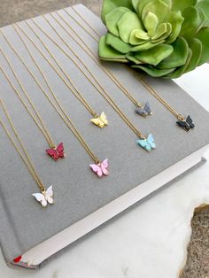 Dainty Butterfly Necklace These dainty Butterfly pendant necklaces are perfect for layering or wearing on their own. Each butterfly is made with beautifully colored acrylic, placed in a gold plated pewter shell. Adorned on your choice of 14k gold plated or 14k gold filled chain. Select your chain length and pendant at checkout. Chain length choices: 14 inches (Choker length) + 2 inch extender chain 15 inches 16 inches 18 inches 20 inches 22 inches 24 inches Color choices: Peach Pearl Sage Green Mint Butterfly, Dainty Butterfly Necklace, Blue Butterfly Necklace, Gray Butterfly, Congrats Gifts, Dainty Jewelry Necklace, Necklace Girlfriend, Dainty Butterfly, Colored Acrylic