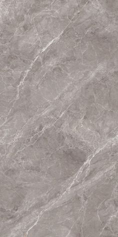 a gray marble textured wall and floor with white lines on the top right corner