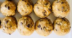 chocolate chip muffins lined up on a white surface