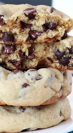 three chocolate chip cookies stacked on top of each other