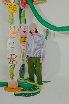 a person standing in front of some art