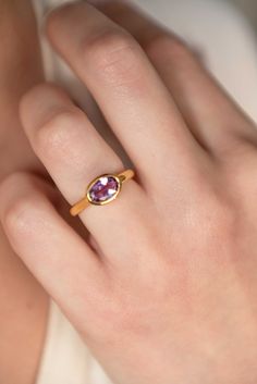 Our Purple Amethyst Ring is handmade with genuine faceted gemstone in an oval shape in 18k gold vermeil over 925 sterling silver. An everyday classic ring with a touch of modern, you will never regret investing in or gifting to your loved ones. Securely set in our sleek and sturdy bezel setting. D E T A I L S * Dimensions - Oval - 11mm x 8mm, stone - 9m x 6mm * Band - 3mm to 2mm * Material: 18k gold vermeil over 925 sterling silver, genuine Amethyst gemstone * See 'Gemstone Rings' tab for more S Timeless Amethyst Ring As A Gift, Timeless Oval Cabochon Sapphire Ring Gift, Timeless Birthstone Ring With Bezel Setting As Gift, Timeless Sapphire Gemstone Ring As A Gift, Timeless Birthstone Ring For Gifts, Everyday Heirloom Gemstone Rings, Modern Gemstone Stackable Rings For Everyday, Classic Everyday Stackable Gemstone Rings, Modern Everyday Stackable Gemstone Rings