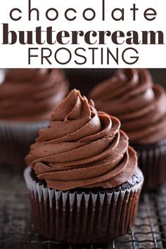 the very best chocolate buttercream frosting on a cooling rack with cupcakes in the background