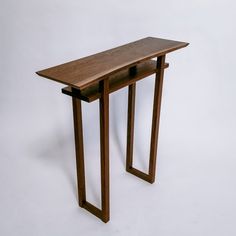 a wooden table sitting on top of a white floor