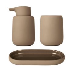 the bathroom accessories are beige and brown