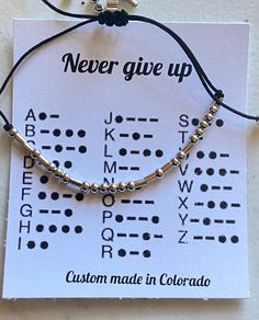 personalized gift for men, personalized gift for woman, Never Give Up Morse Code Bracelet Never Give Up Morse Code Bracelet This bracelet is adjustable with a little slip knot. It's super cute and a friendly reminder to yourself or a loved-one to NEVER GIVE UP. Great for a coworker, a friend going through a hard time, a best friend, a graduate, or anyone who might need a pick-me-up or reminder to just keep going - things will get better. Morse Code Quotes, Bracelet Ideas For Men, Making Morse Code Bracelets, Museum Job, Mens Morse Code Bracelet Diy, I Love You Morse Code Bracelet Diy, Seed Bead Morse Code Bracelet, Until We Meet Again Morse Code Bracelet, Crafternoon Tea