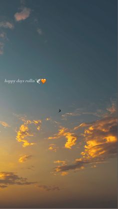 the sky is filled with clouds and birds flying in front of an orange, blue, and yellow sunset