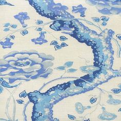 a blue and white fabric with flowers on it