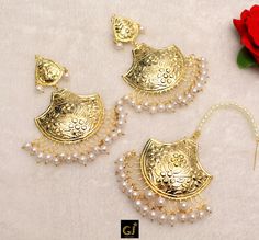 Gold plated high quality jhumka tikka pipal patti set. Extremely light in weight. Earrings length: 3.6 inches (with drops) Width: 2.2 inches Tikka Size: 2.2 inches (Width) Traditional Jhumkas For Eid Ceremonial, Traditional Jhumkas For Eid Ceremony, Traditional Jhumkas For Ceremonial Eid, Traditional Ceremonial Jhumkas For Eid, Traditional White Jhumkas For Eid, Traditional White Danglers For Eid, Traditional Danglers For Eid, Chandbali Jhumkas For Eid And Puja, Traditional Jhumkas For Puja And Eid