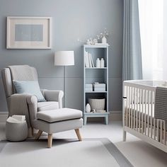 a baby's room with gray walls and white furniture