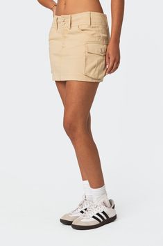 PRODUCT INFO Cargo Skirt Low-rise fit Belt loops Cargo pockets 100% Cotton Model wears size S Model height is 5'7.5 Item care: Wash with similar color Beige Mini Bottoms With Pockets, Beige High-waist Mini Skirt With Pockets, Beige High Waist Mini Skirt With Pockets, Beige Mini Cargo Skirt With Pockets, Casual Mini Skirt With Hip Pockets, Utility Skort With Side Pockets, Utility Mini Skort With Side Pockets, Casual Fitted Skirt With Hip Pockets, Beige Mini Skirt With Pockets