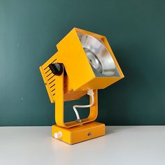 a yellow light is sitting on top of a table