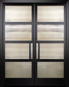 a black double door with frosted glass on the front and side panels that are closed