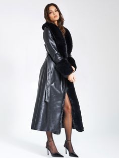 Indulge in opulence with our high quality Zaida Black Vegan Fur Trim Vegan Leather Coat. This stunning maxi coat exudes luxury, adorned with puffy fur trim along the neckline and sleeve openings. Crafted from premium vegan leather and soft vegan fur, it is fully lined for comfort. The coat features a large snap inside the center waist, along with belt loops and a slender leather belt for effortless closure. Versatile and chic, it adds a touch of sophisticated glamour to any special occasion. Cho Chic Evening Fur Coat With Faux Fur Trim, Elegant Long Outerwear With Faux Fur Lining, Chic Evening Outerwear With Faux Fur Trim, Luxury Fur Coat With Faux Fur Trim For Party, Luxury Party Outerwear With Faux Fur Trim, Luxury Long Coat With Faux Fur Lining, Luxury Faux Fur Outerwear For Evening, Luxury Fur Coat For Winter Parties, Luxury Long Fur Coat With Faux Fur Lining