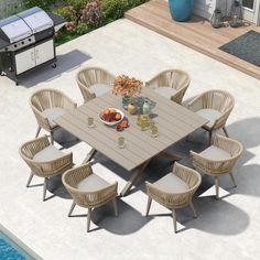 an outdoor dining table and chairs near a swimming pool with bbq grill in the background