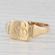 Metal: 18k Yellow Gold  Weight: 3.2 Grams  Stamps: British Hallmarks Face Height: 8.6 mm  Rise Above Finger: 0.9 mm Band / Shank Width: 3.1 mm This ring is a size 8, but it can be resized down 3 sizes for a $30 fee or up 3 sizes for a $50 fee. If you would like your ring resized, please select the appropriate fee from the listing below in order to pay the sizing fee: https://www.etsy.com/listing/781388346/ring-sizing-service-fee Each piece is thoroughly examined and refinished as needed by our professional jewelers, graded by our in-house GIA (Gemological Institute of America) Graduate Gemologist, and inspected for quality before being carefully packaged and promptly shipped. [SKU: B35329] phd Gold Signet Ring With Maker's Mark, Gold Round Signet Ring With Maker's Mark, Classic White Gold Initial Ring With Diamond Cut, Classic Wedding Jewelry With Hallmarks, Classic Yellow Gold Signet Ring With Maker's Mark, Classic Yellow Gold Engraved Ring With Maker's Mark, Classic Engraved Yellow Gold Ring With Maker's Mark, Timeless Formal Engraved Ring With Hallmarks, Engraved Yellow Gold Signet Ring For Formal Occasions