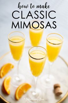 three glasses filled with orange juice and garnished with cinnamon on a white plate