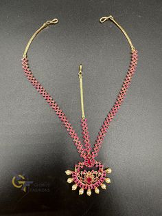 Beautiful Ruby stones with pearls tikka Handmade jewelry  Silver plated jewelry  One gram jewelry Official Website globusfashions.com 🌸 S H O P . M O R E . S T Y L E S  🌸 https://www.etsy.com/shop/Globusfashions 🌸 C O N N E C T . W I T H . U S  🌸 Please share/ tag us with your photos adorning our jewelry on our social media pages : https://www.pinterest.com/globusfashions https://www.instagram.com/globusfashions https://www.facebook.com/globusfashions 🌸 C A R E . T I P S  🌸 We don't want your special moments to fade. To maintain the quality of your jewelry, please : - Do not wear it to the pool, spa, or the beach. - Remove when sleeping, exercising, or doing other physically strenuous activities. - Avoid contact with perfumes, body oils, and other chemicals, including household clean Celebration Temple Jewelry Tikka With Hand Set, Pink Adjustable Jewelry For Puja, Adjustable Temple Jewelry Tikka With Stone Work, Pink Temple Jewelry Tikka With Tilla, Pink Tilla Temple Jewelry Tikka, Pink Tilla Tikka Temple Jewelry, Nethi Chutti, Mang Tikka, Bridal Hair Jewelry