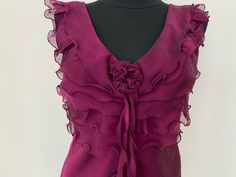 Vintage designer handcrafted Ruffled purple  Gatsby style 1920s sleeveless blouse Size S/M  Measurements Length 58cm/23.6 inches Width waist 38/15inches Width chest 43cm/16.9inches Excellent condition Sleeveless Ruffled Blouse For Wedding, Sleeveless Silk Blouse With Ruffles, Formal Purple Summer Blouse, Purple Silk Evening Blouse, Pink Sleeveless Evening Blouse, Purple Silk Evening Top, Purple Ruffled Blouse For Party, Elegant Purple Blouse With Ruffles, Elegant Purple Evening Blouse